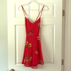 Adjustable red and floral open back dress.